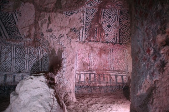 Inside the graves, painted walls and ceilings